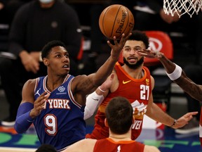 Canadian NBA stars RJ Barrett, left, and Jamal Murray, are amongst a group of 14 players who have committed to the program for the next three summers.