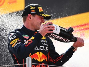 Race winner Max Verstappen celebrates on the podium during the F1 Grand Prix of Spain at Circuit de Barcelona-Catalunya on May 22, 2022 in Barcelona, Spain.