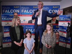B.C. Liberal leader Kevin Falcon is joined by his wife Jessica Elliott and daughters Rose, front left, and Josephine as he addresses supporters after winning a byelection for a seat in the legislature in the riding of Vancouver-Quilchena, in Vancouver, on Saturday, April 30, 2022.