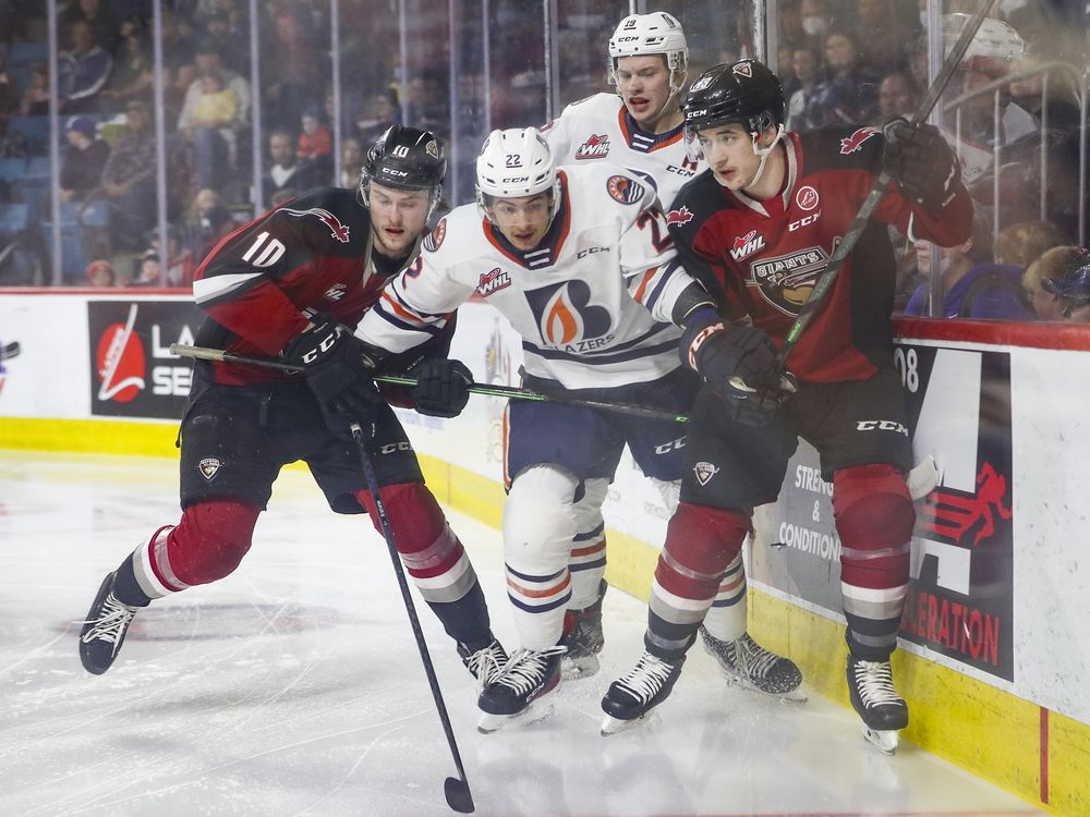 Giants captain Zack Ostapchuk, left, leaning into the Blazers’ Daylan Kuefler during Game 2 on Saturday, says Vancouver must do a better job of getting to rebounds on the power play and retrieving pucks.
