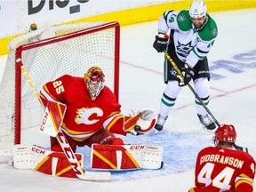 Calgary Flames goaltender Jacob Markstrom (25) makes a save against the Dallas Stars during the second period in game one of the first round of the 2022 Stanley Cup Playoffs at Scotiabank Saddledome.