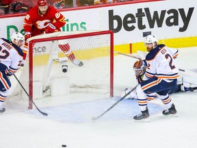 Edmonton Oilers goaltender Mikko Koskinen reacts as Calgary Flames centre Trevor Lewis (22) passes the puck during the third period of Game 1 at Scotiabank Saddledome in Calgary on May 18, 2022.