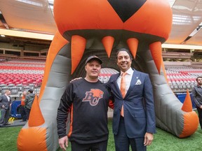 Head coach Rick Campbell and B.C. Lions owner Amar Doman