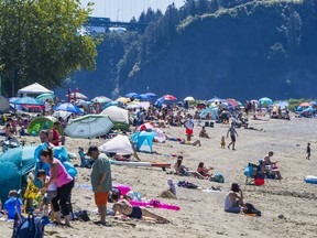 People deal with heat wave at Ambleside beach West Vancouver on June 26, 2021.