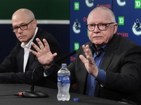 Canucks president of hockey operations Jim Rutherford, with general manager Patrik Allvin (left) in tow, talks to Vancouver media on Tuesday. ‘We would be willing to have him back under the contract that he agreed to when he came here,’ Rutherford said of coach Bruce Boudreau.