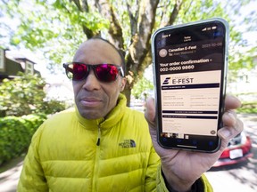 Alan Walrond showing his purchased tickets for the 2022 Canadian E-Fest race event, in Vancouver on May 19.
