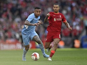 Soccer Football - FA Cup Semi Final - Manchester City v Liverpool - Wembley Stadium, London, Britain - April 16, 2022 . Manchester City's Gabriel Jesus in action with Liverpool's Naby Keita Action Images via Reuters/Tony Obrien