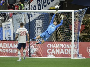 Vancouver Whitecaps goaltender Cody Cropper (55) reaches for the ball after a shot by the Valour FC during the first half at B.C. Place on May 11, 2022.
