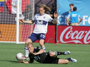Whitecaps defender Florian Jungwirth, looming over a fallen Karol Swiderski of Charlotte FC during last Sunday’s MLS game in Charlotte, N.C., says the Caps want to keep their recent momentum going. ‘We’re on a good path,’ he says. ‘I feel like it’s a game where whoever wants it more will get it.’