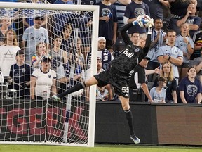 Vancouver Whitecaps goaltender Cody Cropper (55) stops a shot on goal against Sporting Kansas City in the first half at Children's Mercy Park.