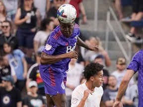 May 28, 2022;  Kansas City, Kansas, United States;  Vancouver Whitecaps defenseman Javain Brown (23) heads the ball during the first half at Children's Mercy Park against Sporting Kansas City.