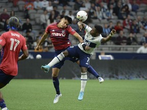 FC Dallas defender Marco Farfan (4) goes up for a header against Vancouver Whitecaps forward Deiber Caicedo (7) during the first half last May at B.C. Place. Caicedo won't be in the lineup Saturday but could be in less than a week as he works his way back from a knee injury.