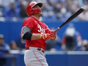 Joey Votto of the Cincinnati Reds hits a solo home run in the eighth inning against the Toronto Blue Jays at Rogers Centre on May 22, 2022 in Toronto.