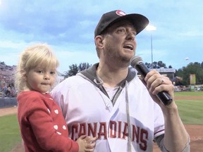 Michael Buble and his youngest child, Vida, sing Take Me Out to the Ball Game at a Vancouver Canadians game on Tuesday, May 31, 2022.
