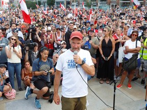 James Topp, a Canadian Forces veteran who marched across Canada protesting against the COVID-19 mandates, speaks to supporters as he arrives at the Tomb of the Unknown Soldier and the National War Memorial ahead of Canada Day in Ottawa, June 30, 2022.