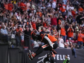 B.C. Lions' James Butler celebrates his third touchdown against the Edmonton Elks during the first half of CFL football game in Vancouver, on Saturday, June 11, 2022.