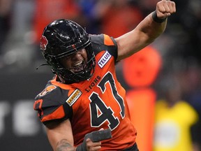 B.C. Lions' Sione Teuhema celebrates after sacking Edmonton Elks quarterback Nick Arbuckle during the second half of CFL football game in Vancouver, on Saturday, June 11, 2022.