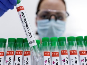 Test tubes labelled "Monkeypox virus positive."