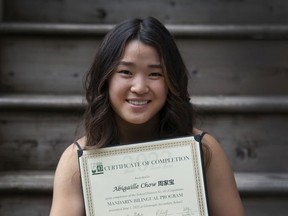 Abby Chow is a Grade 12 student at Gleneagle Secondary School in Coquitlam, BC. She entered the first year of the district's mandarin immersion program in Grade 1, and is now part of its first graduating class. (Photo by Jason Payne/ PNG)