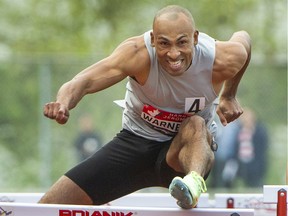 VANCOUVER, BC - June 14, 2022 - Damian Warner's left foot catches the hurdle during 110 metre hurdle at  Harry Jerome Track Classic at Swangard Stadium in Burnaby, BC., June 14, 2022.
(Arlen Redekop / Postmedia staff photo)