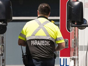 A paramedic wearing the new uniform arrives at St. Paul's Hospital in Vancouver on June 27.
