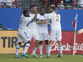 Jun 18, 2022; Frisco, Texas, USA; Vancouver Whitecaps forward Lucas Cavallini (9) celebrates with teammates after scoring a goal against FC Dallas in the first half at Toyota Stadium.