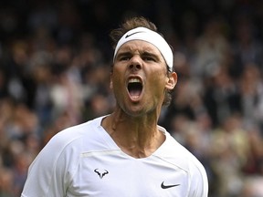 Tennis - Wimbledon - All England Lawn Tennis and Croquet Club, London, Britain - June 28, 2022 Spain's Rafael Nadal celebrates after winning his first round match against Argentina's Francisco Cerundolo.