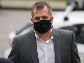 Former Vancouver Whitecaps women's and Canada U-20 women's soccer coach Bob Birarda arrives at provincial court for a sentencing hearing in North Vancouver on Wednesday. Birarda pleaded guilty in February to three counts of sexual assault and one count of touching a young person for a sexual purpose.