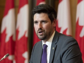 Immigration, Refugees and Citizenship Minister Sean Fraser speaks during a news conference with United Nations High Commissioner for Refugees Filippo Grandi, Wednesday, April 6, 2022 in Ottawa.The federal government says it is now prioritizing temporary travel visas for foreigners to attend the World AIDS conference in Montreal at the end of July.