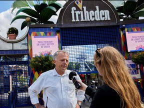 Manager of Tivoli Friheden Henrik Ragborg Olsen speaks to the press outside the closed Tivoli Friheden amusement park, in Aarhus, western Denmark, after a 14-year-old girl was killed and a 13-year-old boy injured in a roller coaster accident on July 14, 2022.