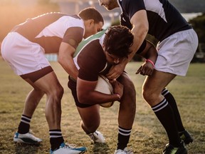 Rugby players striving to get to the ball