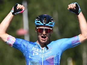 Israel-Premier Tech team's Canadian rider Hugo Houle celebrates as he cycles to the finish line to win the 16th stage of the 109th edition of the Tour de France cycling race, 178,5 km between Carcassonne and Foix in southern France, on July 19, 2022.
