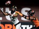 Hamilton Tiger-Cats' Tim White (12) fails to make the reception in the end zone on a two-point conversion attempt as B.C. Lions' Marcus Sayles (14) defends during the second half of CFL football game in Vancouver, on Thursday, July 21, 2022.