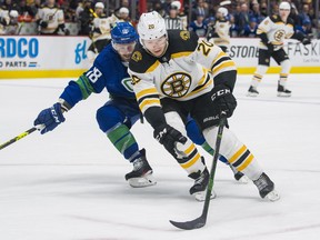 The Canucks have signed Boston Bruins forward Curtis Lazar to a three-year deal that carries an annual average value of US$1 million.