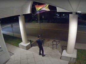 The Delta Police Department is investigating after a man, seen in this surveillance video footage, allegedly vandalized a Pride flag outside Ladner United Church.
