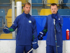 Former Canucks forward Mikael Samuelsson and Henrik Sedin at the club's annual development camp at UBC last week.