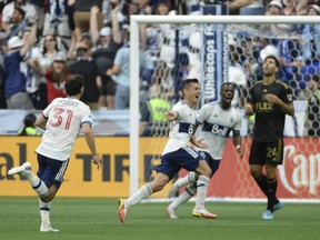Vancouver Whitecaps midfielder Andres Cubas (20) celebrates his goal against Los Angeles FC keeper Maxime Crepeau (16) (not pictured) at B.C. Place on July 2, 2022.