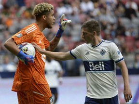 Minnesota United FC goalkeeper Dayne St. Clair (97) reacts as Vancouver Whitecaps FC midfielder Ryan Gauld (25) tries to take the ball for a corner kick during the first half at BC Place.