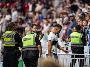 Vancouver Whitecaps' Lucas Cavallini leaves the field after receiving a red card during second-half MLS action against Nashville FC in Vancouver last Saturday.