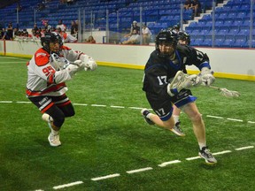 Curtis Dickson of the Langley Thunder tries to evade Jerrett Smith of the Nanaimo Timbermen in WLA action from the regular season. Langley and Nanaimo open the best-of-seven league championship series tonight at the Langley Events Centre.