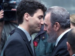 Justin Trudeau gets a hug from Cuban President Fidel Castro in front of Notre-Dame Basilica in Montreal prior to the funeral of Pierre Trudeau, Oct 3, 2000.