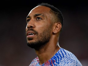 Barcelona's Gabonese midfielder Pierre-Emerick Aubameyang looks on before the start of the friendly football match between FC Barcelona and Manchester City, at the Camp Nou stadium in Barcelona on August 24, 2022.