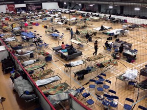 Cots litter the gym floor at an evacuee reception centre  set up for evacuees from Fort McMurray, Alta when the city was evacuated during a wildfire in 2016.