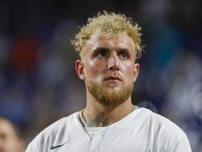 Aug 16, 2022; Miami, Florida, USA; YouTube personality and boxer Jake Paul listens to the national anthem prior to the game between the Miami Marlins and the San Diego Padres at loanDepot Park.