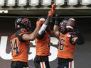 Who needs to be top 10 in CFL targets? Keon Hatcher, Dominique Rhymes and Bryan Burnham (left to right) celebrate a Burnham touchdown earlier this season.