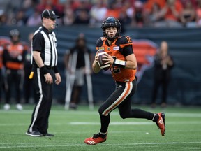 Lions quarterback Nathan Rourke looks to pass during the first half of Saturday’s game against the visiting Edmonton Elks.