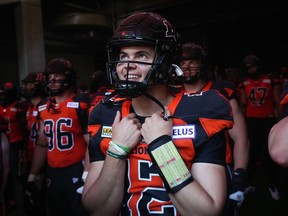 BC Lions quarterback Nathan Rourke, 12, waits to run onto the field for introductions before the CFL football game against the Edmonton Elks in Vancouver on Saturday, June 11, 2022. One for his CFL record book. The 24-year-old Victoria native injured his leg last week in his 28-10 victory over Saskatchewan against the Rough Riders, which the BC Lions won. Rourke is scheduled to undergo surgery and, while optimistic about his late-season return, the 2022 campaign remains very much in jeopardy.