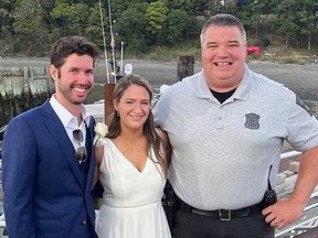 Patrick Mahoney and Hannah Crawford are pictured with Boston Police officer Joe Matthews.