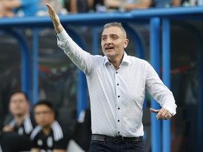Vancouver Whitecaps coach Vanni Sartini argues with the referee as his team plays against Charlotte FC in the second half of an MLS soccer match in Charlotte, N.C., Sunday, May 22, 2022.