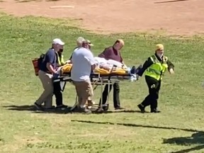 Author Salman Rushdie is transported to a helicopter after he was stabbed on stage before his scheduled speech at the Chautauqua Institution, Chautauqua, New York, U.S., August 12, 2022.